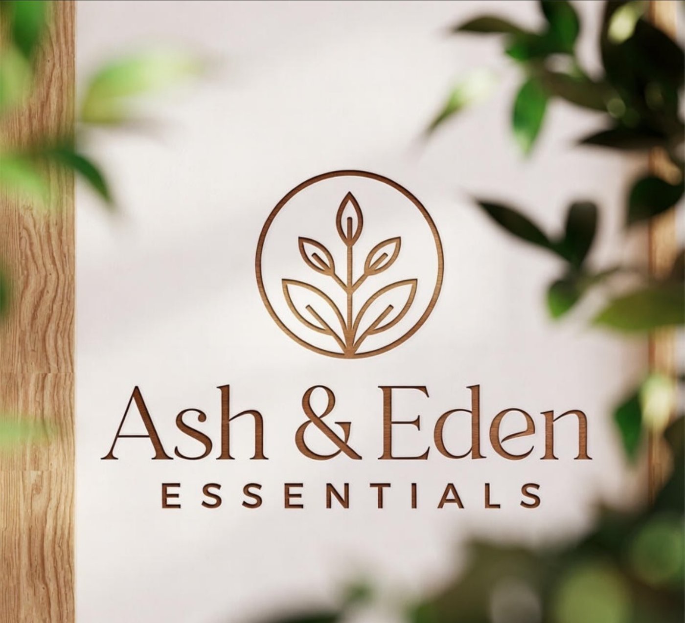 Ash & Eden Essentials wood-carved logo sign